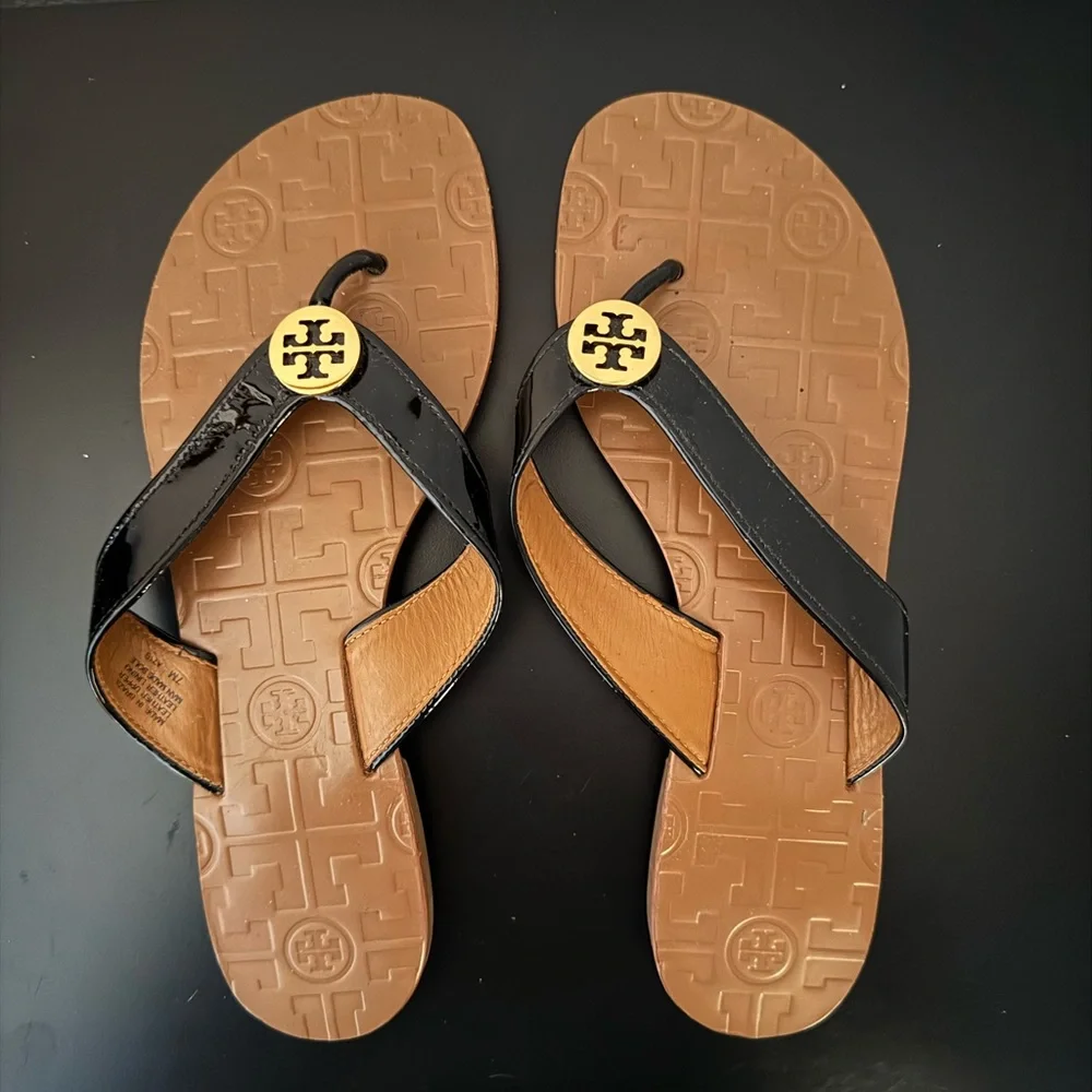 Tory Burch Black and Tan Flip Flops - Picture 1 of 3